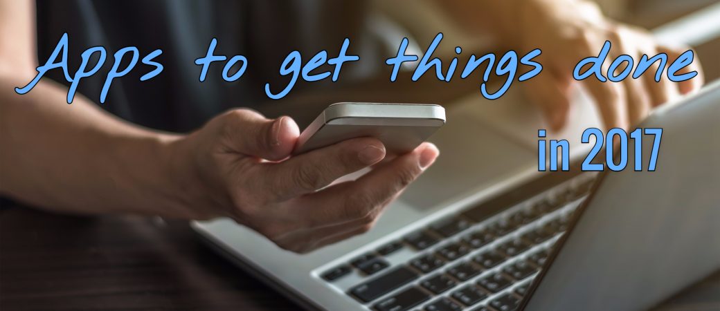 man using smartphone and computer using apps